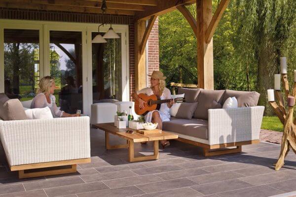 two people on their patio outside in front of their patio door