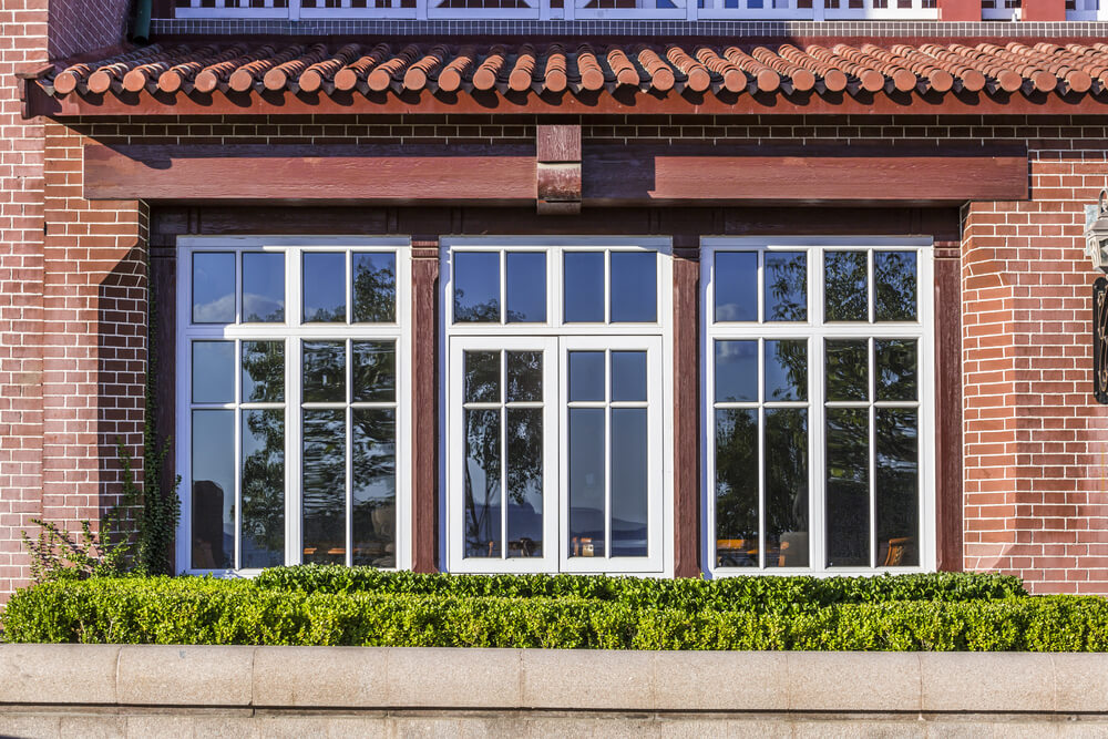 casement windows in a brick house