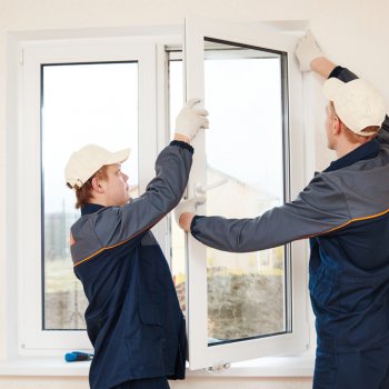 workers installing a new window