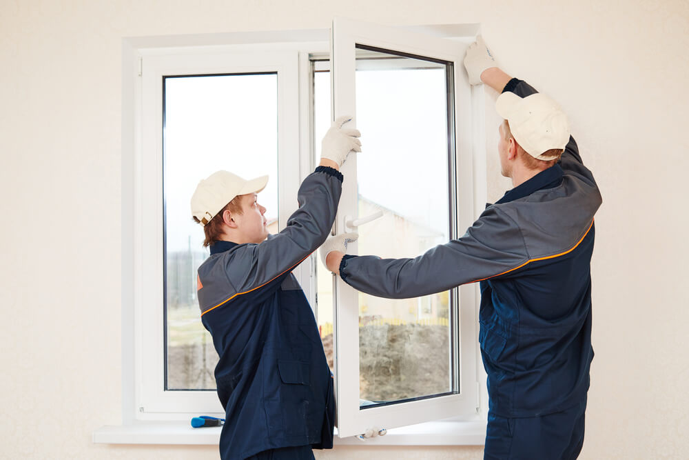 workers installing a new window