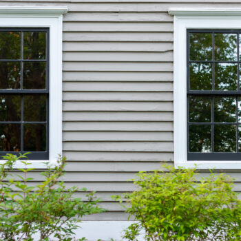 Two double hung windows as seen from a home's exterior