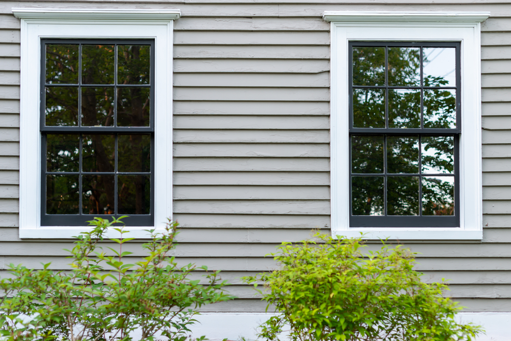 Two double hung windows as seen from a home's exterior